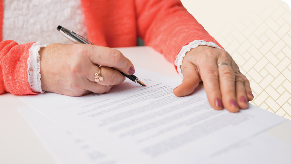 Woman filling out CCRC contract